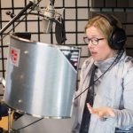 Esther narrating a book in her professional soundproof studio
